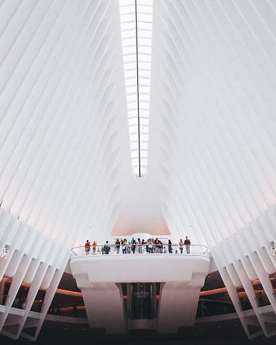 new york people standing near balusters under white high ceiling architecture